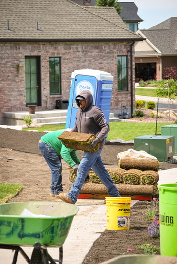 Laying fresh sod on a new build