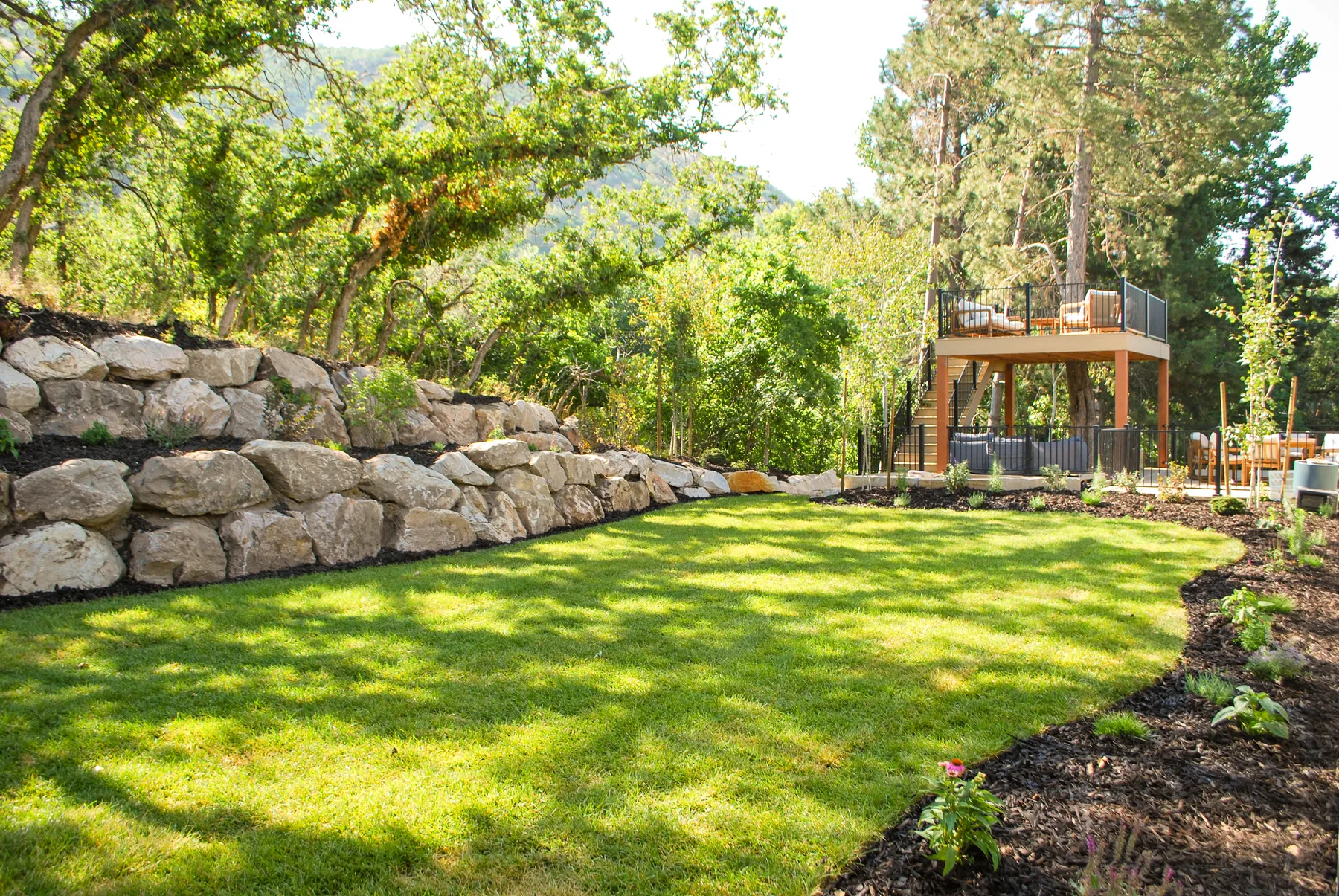 Boulder and block retaining wall installation