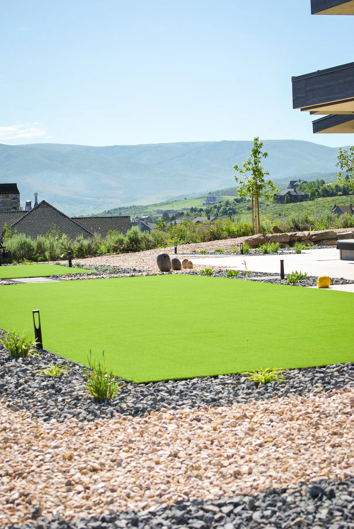 Synthetic turf lawn and putting green installation