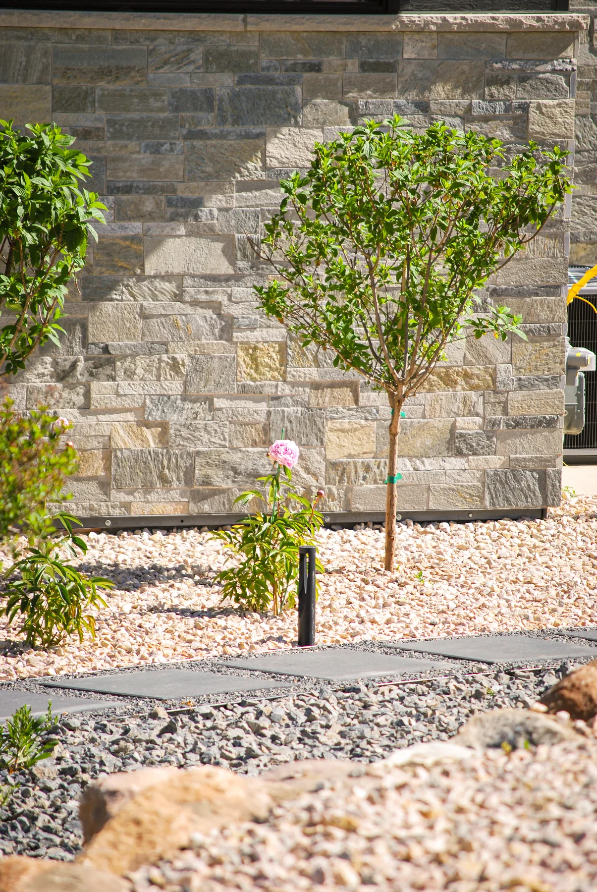 Water-wise xeriscape landscaping with rock and boulders