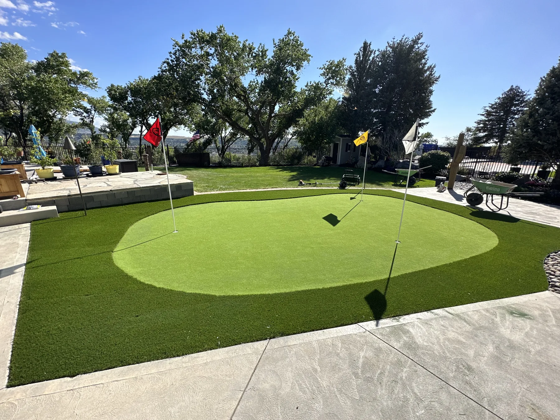 Synthetic turf lawn and putting green installation