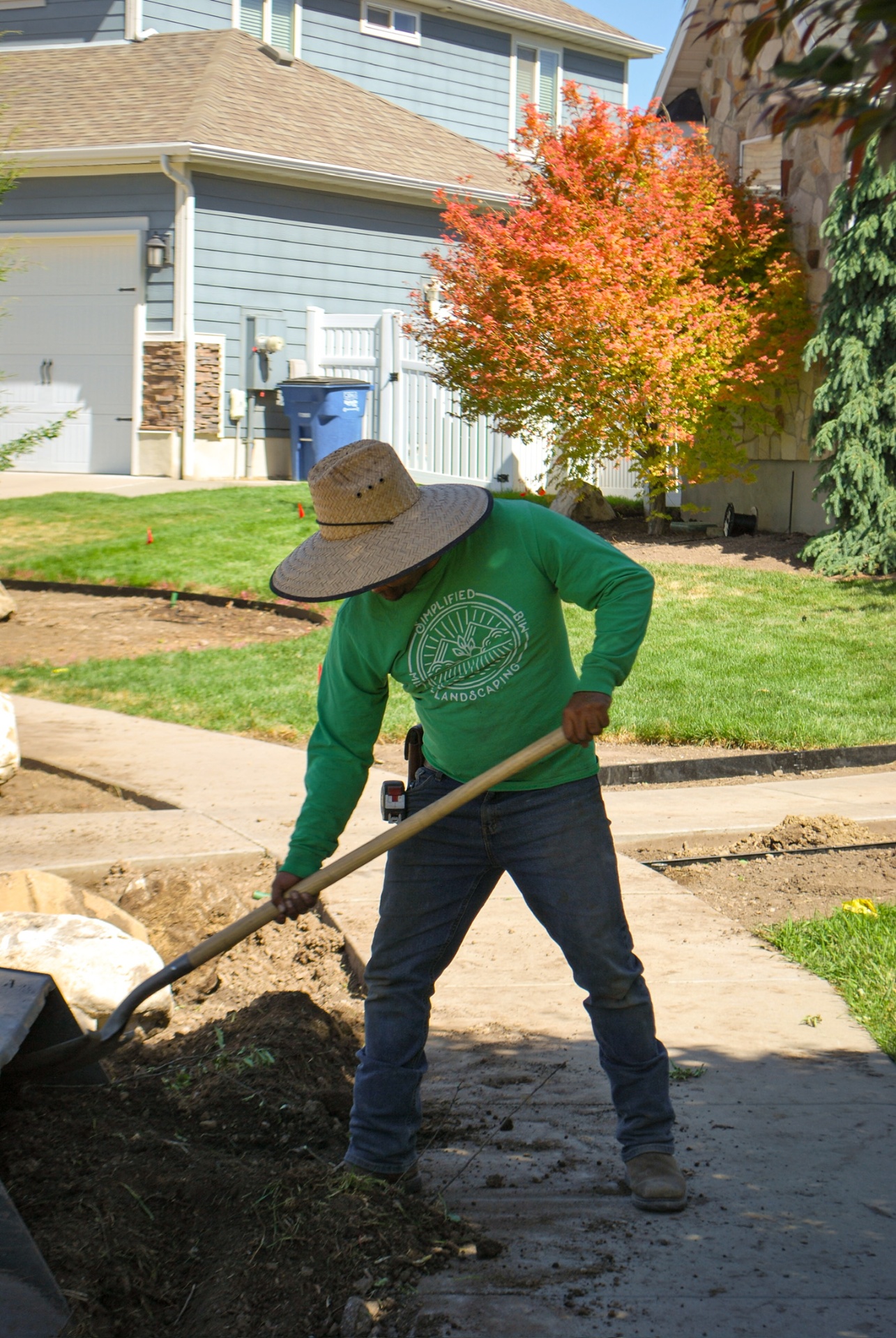 Crew member edging a walkway