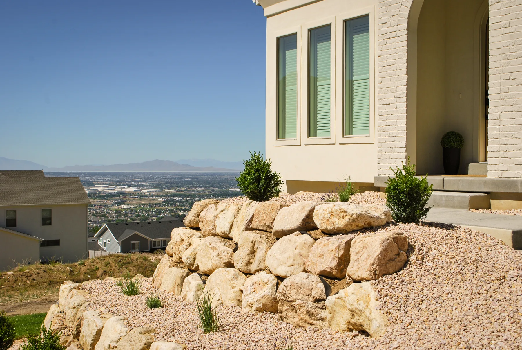Boulder and block retaining wall installation